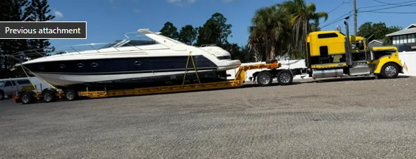 Luxury yacht securely loaded on AutoStar Transport Express trailer for safe nationwide shipping